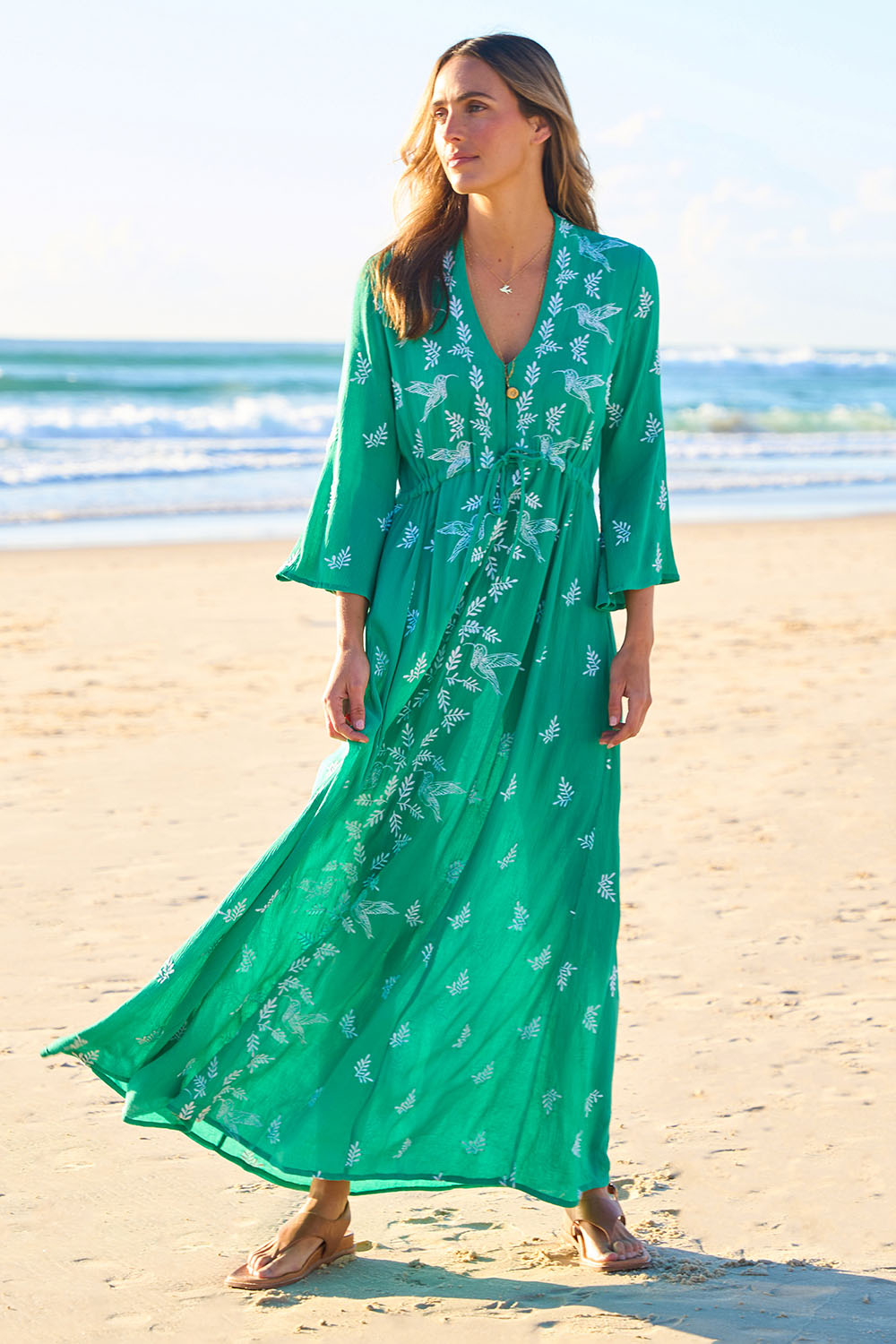 Model Tegan wearing size 10 of the Dancing With Birds Dress in colour Emerald (Green), from the front, showing the whole outfit