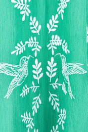 Product shot of the Dancing With Birds Dress in colour Emerald (Green), detail