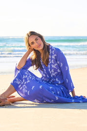 Model Tegan wearing size 10 of the Dancing With Birds Dress in colour Persian (Blue), from the front, showing the whole outfit