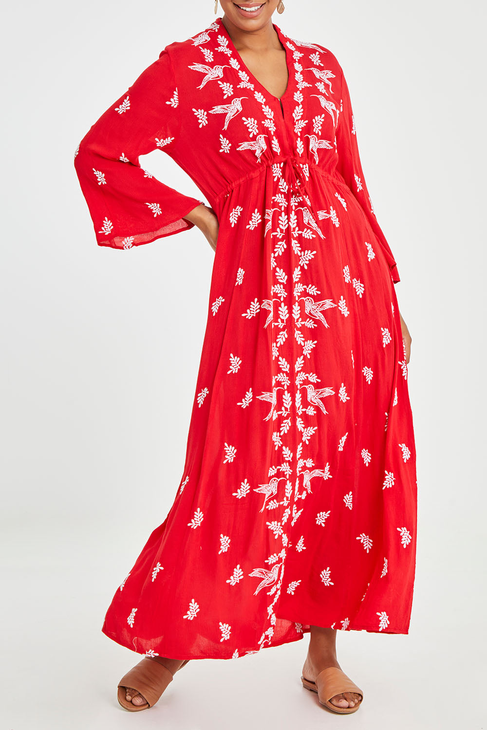 Model Noli wearing size 14 of the Dancing With Birds Dress in colour Scarlet (Red), from the front, cropped image