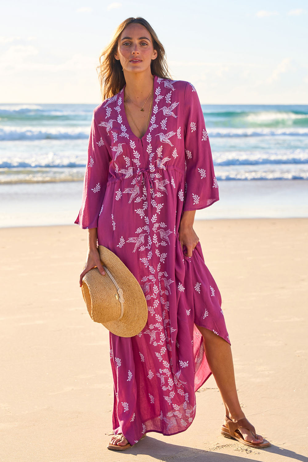 Model Tegan wearing size 10 of the Dancing With Birds Dress in colour Wildberry (Purple), from the front, showing the whole outfit