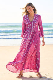 Model Tegan wearing size 10 of the Dancing With Birds Dress in colour Wildberry (Purple), from the front, showing the whole outfit