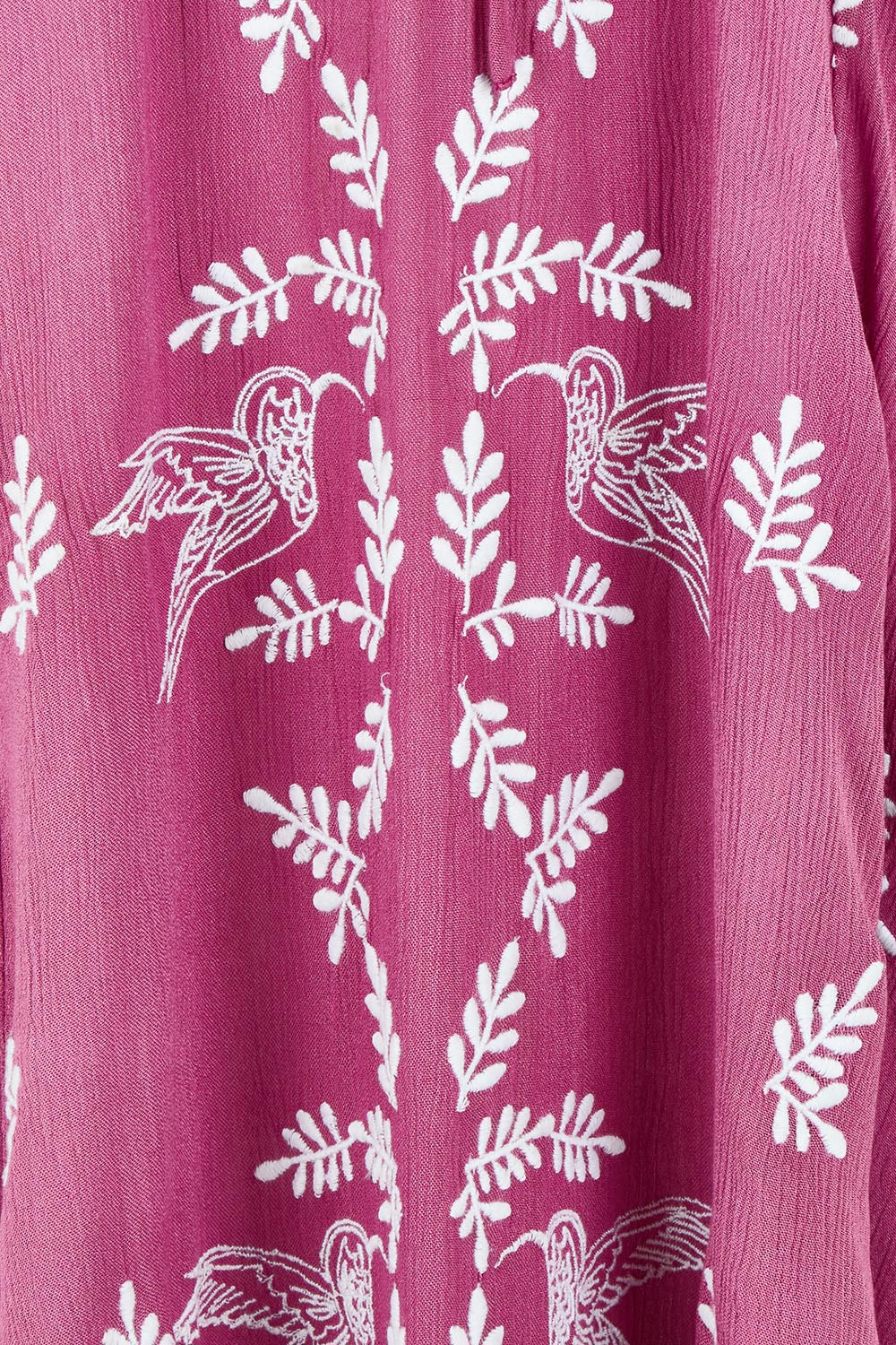 Product shot of the Dancing With Birds Dress in colour Wildberry (Purple), detail