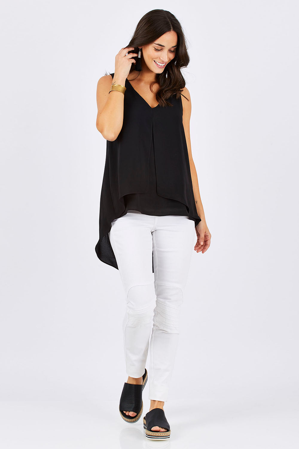 Model Georgia wearing size 10 of the Sugar Snaps Layers Tank in colour Black (Black), from the front, showing the whole outfit
