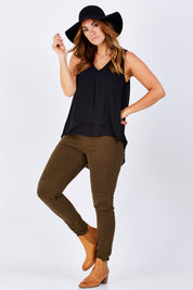Model Laura wearing size 12 of the Sugar Snaps Layers Tank in colour Black (Black), from the front, showing the whole outfit