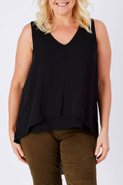 Model Natalie wearing size 16 of the Sugar Snaps Layers Tank in colour Black (Black), from the front, cropped image