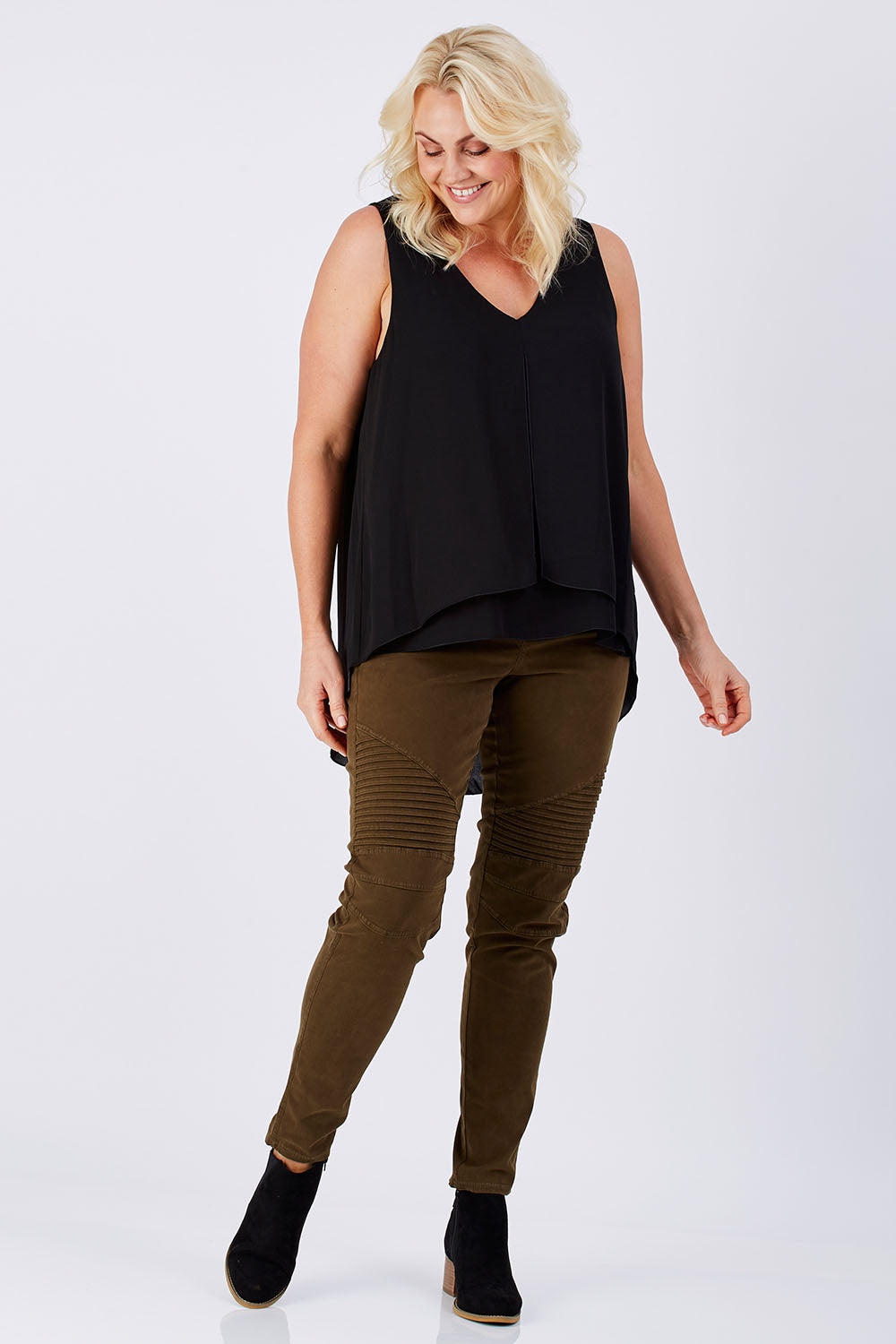 Model Natalie wearing size 16 of the Sugar Snaps Layers Tank in colour Black (Black), from the front, showing the whole outfit