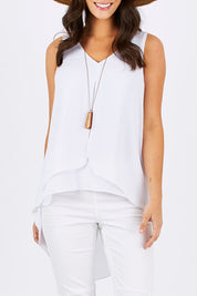 Model Georgia wearing size 10 of the Sugar Snaps Layers Tank in colour White (White), from the front, cropped image
