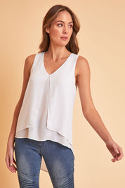 Model Madeline wearing size 10 of the Sugar Snaps Layers Tank in colour White (White), from the front, showing the whole outfit