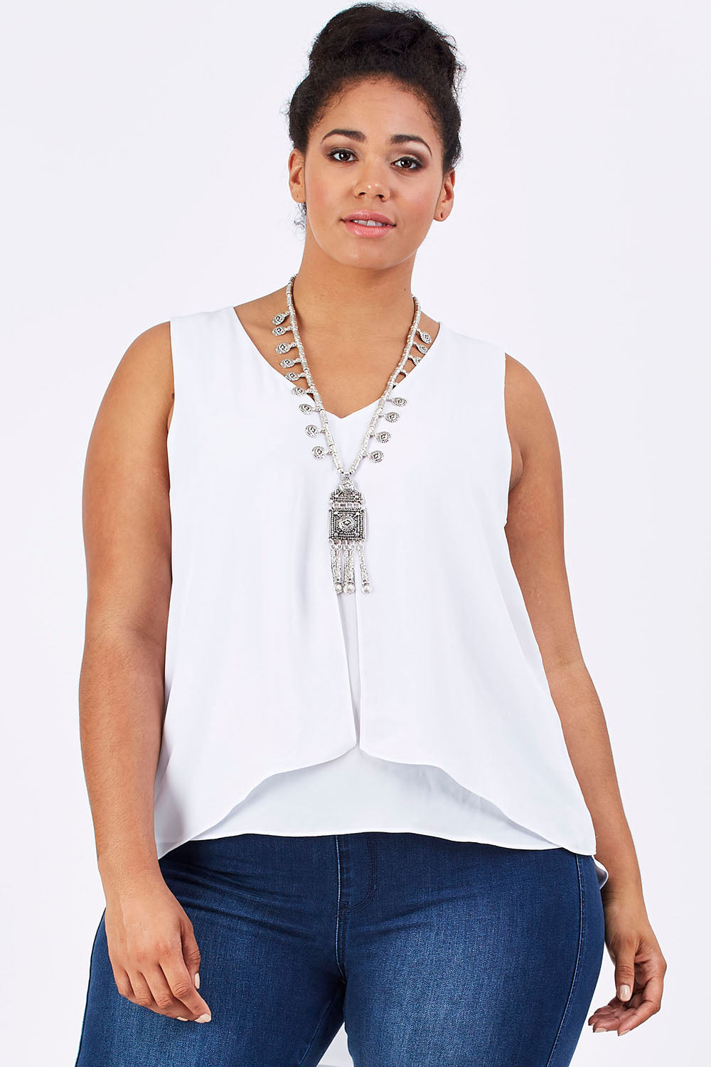 Model Shareefa wearing size 18 of the Sugar Snaps Layers Tank in colour White (White), from the front, cropped image