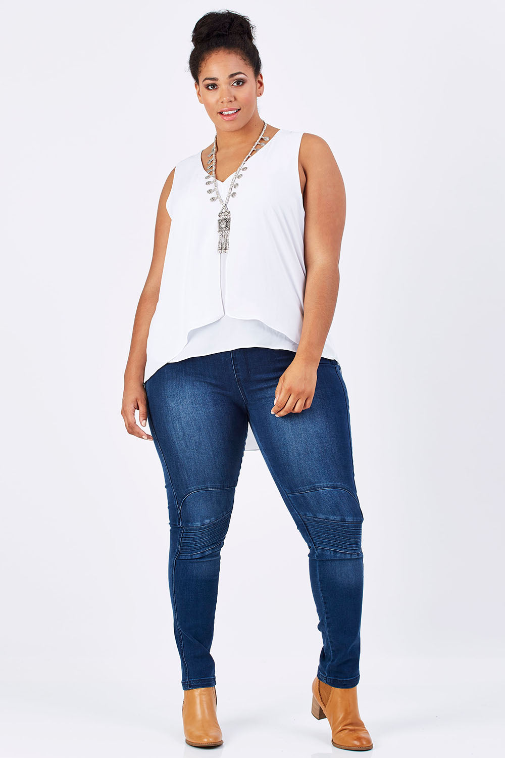Model Shareefa wearing size 18 of the Sugar Snaps Layers Tank in colour White (White), from the front, showing the whole outfit