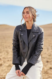 Model Tegan wearing size 10 of the Urban Nomad Leather Jacket in colour Black (Black), from the front, showing the whole outfit