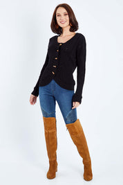 Model Andrea wearing size S of the Fireside Button Cardigan in colour Black (Black), from the front, showing the whole outfit