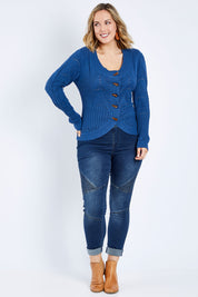 Model Jess wearing size L of the Fireside Button Cardigan in colour Bluejean (Blue), from the front, showing the whole outfit