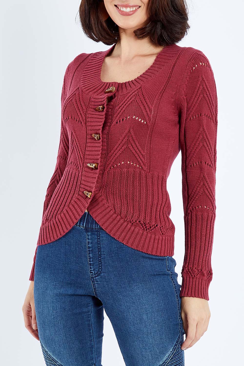 Model Andrea wearing size S of the Fireside Button Cardigan in colour Plum (Red), from the front, cropped image