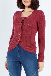 Model Andrea wearing size S of the Fireside Button Cardigan in colour Plum (Red), from the front, cropped image