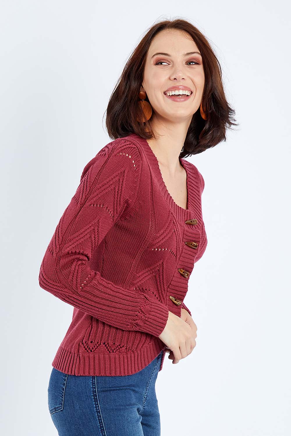 Model Andrea wearing size S of the Fireside Button Cardigan in colour Plum (Red), from the front, cropped image