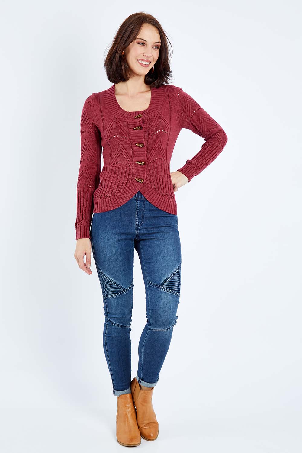 Model Andrea wearing size S of the Fireside Button Cardigan in colour Plum (Red), from the front, showing the whole outfit
