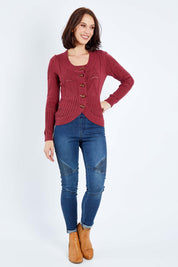 Model Andrea wearing size S of the Fireside Button Cardigan in colour Plum (Red), from the front, showing the whole outfit