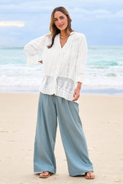 Model Tegan wearing size 10 of the Whispers In The Dark Shirt in colour Milk (White), from the front, showing the whole outfit