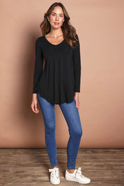 Model Madeline wearing size 10 of the Long Sleeve Softly Swinging Bamboo Tee in colour Black (Black), from the front, showing the whole outfit