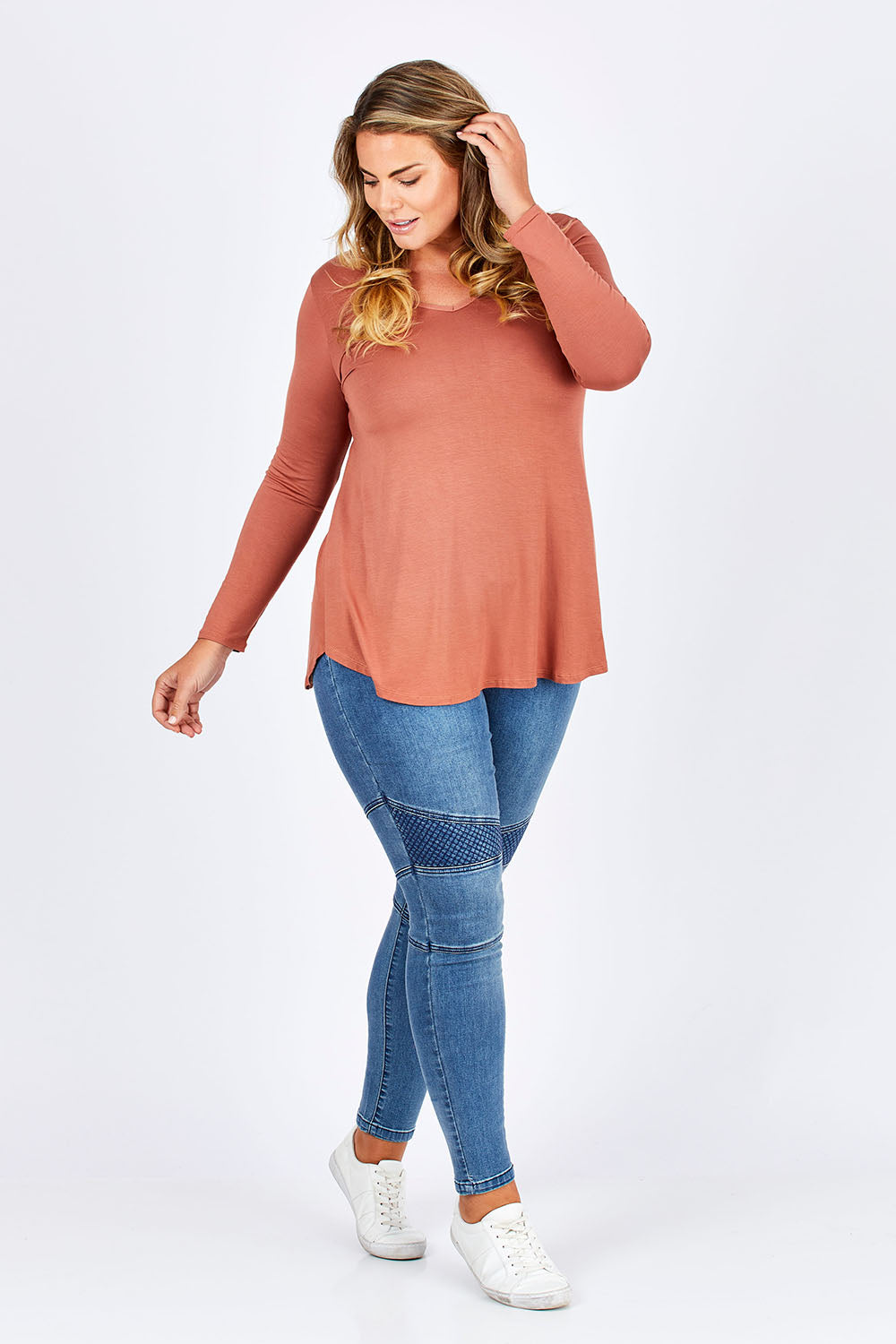 Model Fiona wearing size 16 of the Long Sleeve Softly Swinging Bamboo Tee in colour Copper, from the front, showing the whole outfit