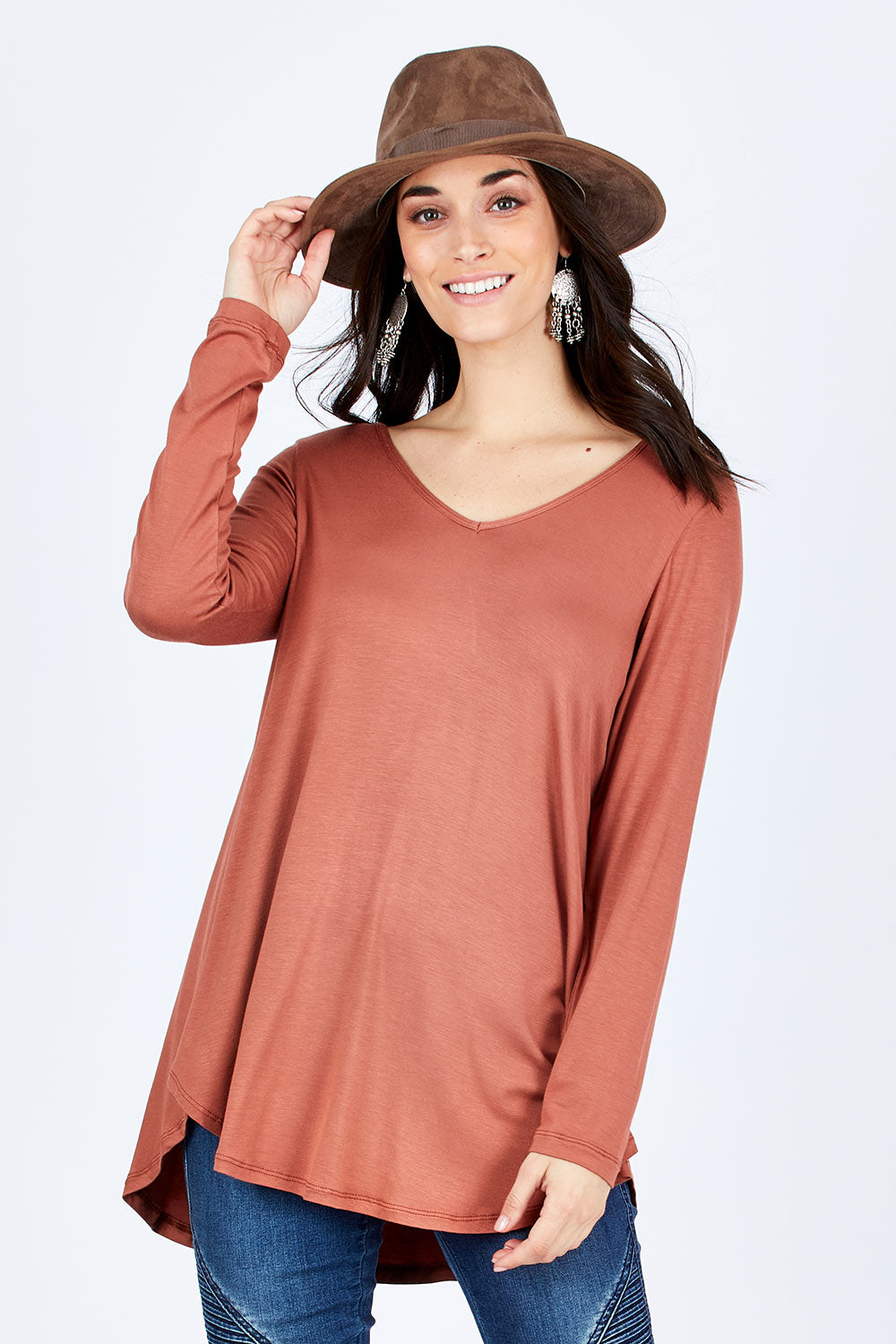 Model Georgia wearing size 10 of the Long Sleeve Softly Swinging Bamboo Tee in colour Copper, from the front, cropped image