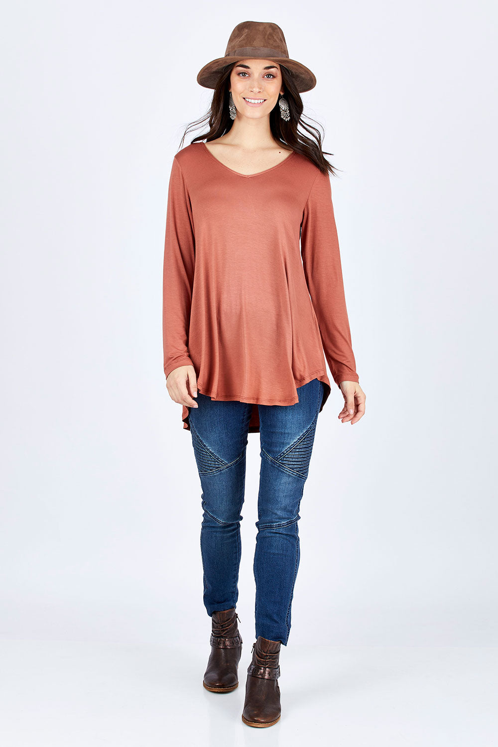 Model Georgia wearing size 10 of the Long Sleeve Softly Swinging Bamboo Tee in colour Copper, from the front, showing the whole outfit