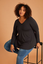Model Alexis wearing size 16 of the Long Sleeve Softly Swinging Bamboo Tee in colour Storm (Grey), from the front, showing the whole outfit