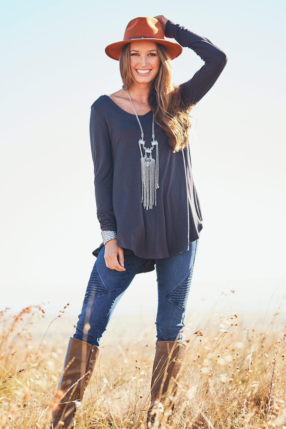Model Emma wearing size 10 of the Long Sleeve Softly Swinging Bamboo Tee in colour Storm (Grey), from the front, showing the whole outfit