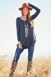 Model Emma wearing size 10 of the Long Sleeve Softly Swinging Bamboo Tee in colour Storm (Grey), from the front, showing the whole outfit