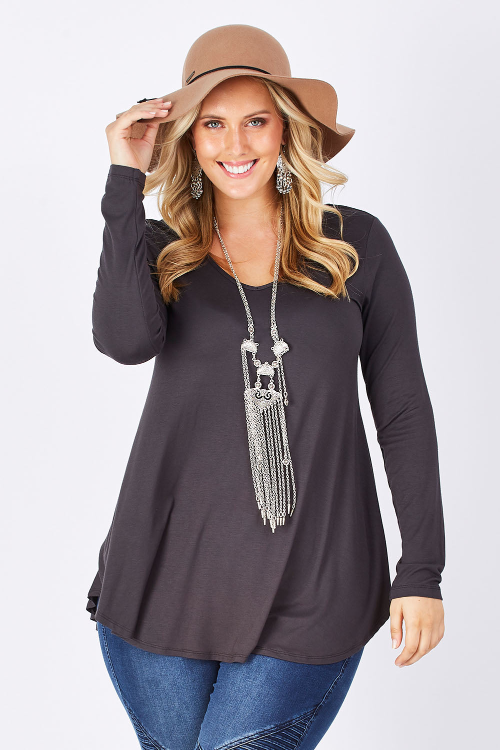 Model Jess wearing size 14 of the Long Sleeve Softly Swinging Bamboo Tee in colour Storm (Grey), from the front, cropped image