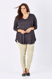 Model Mae wearing size 18 of the Long Sleeve Softly Swinging Bamboo Tee in colour Storm (Grey), from the front, showing the whole outfit
