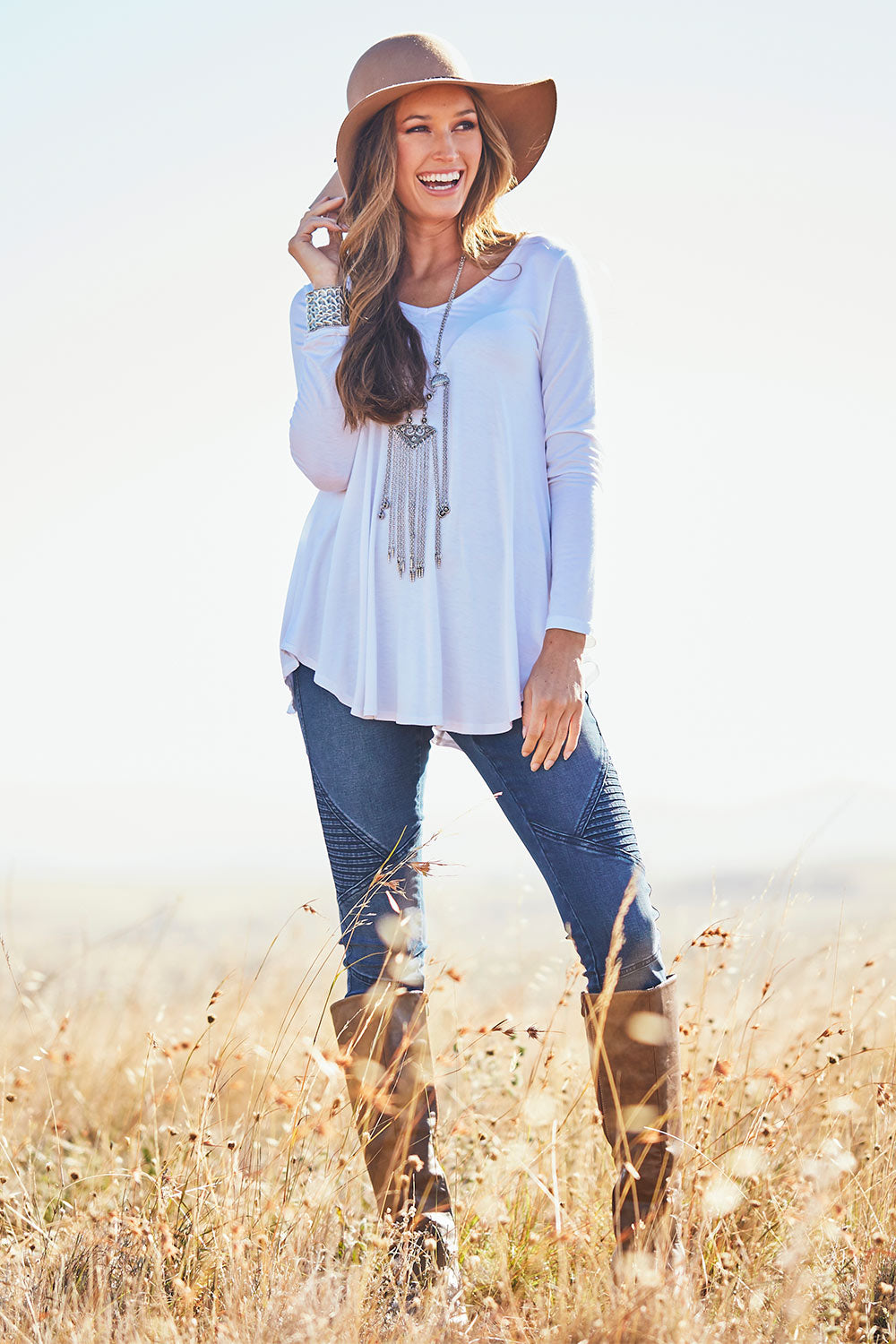 Model Emma wearing size 10 of the Long Sleeve Softly Swinging Bamboo Tee in colour White (White), from the front, showing the whole outfit