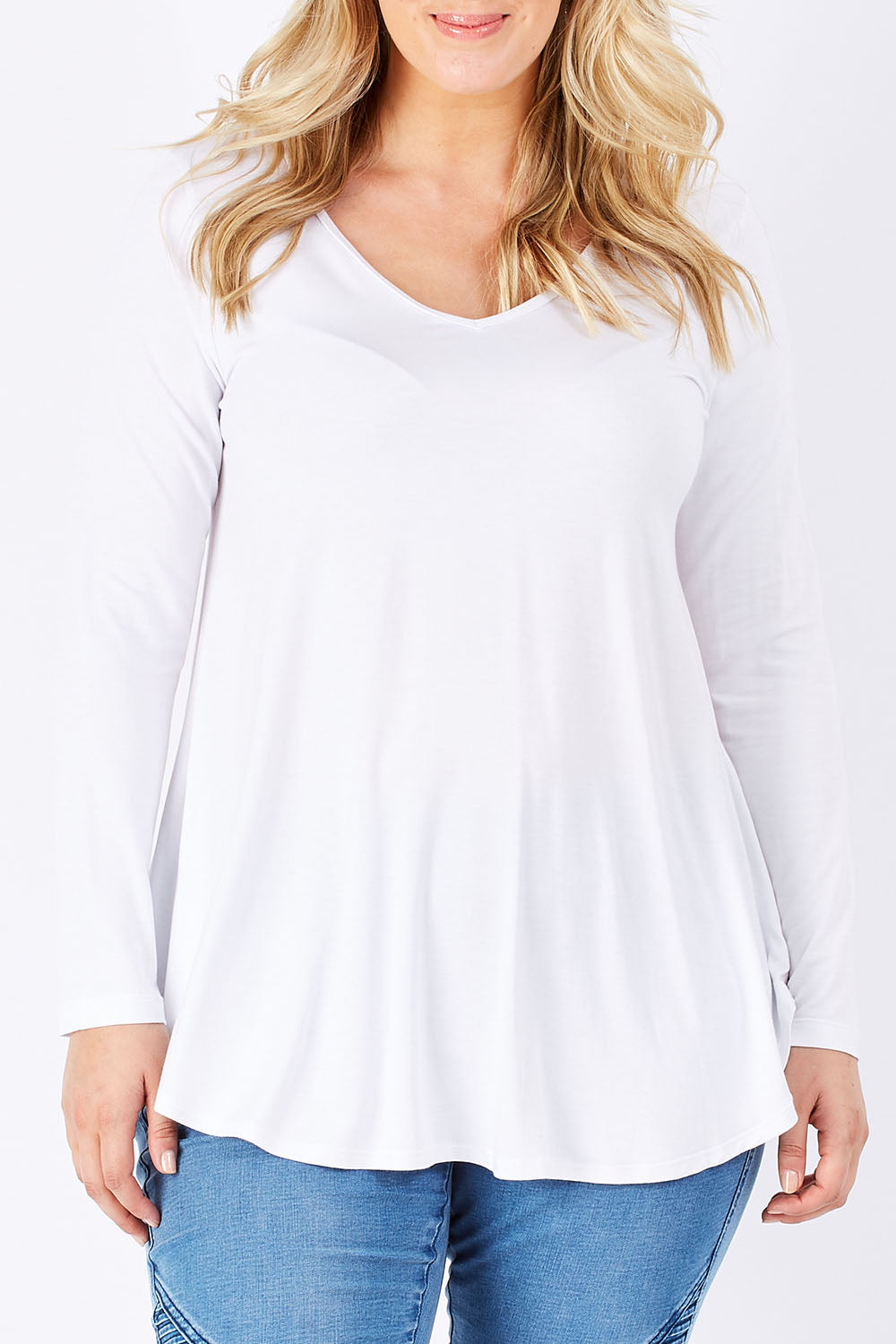 Model Jess wearing size 14 of the Long Sleeve Softly Swinging Bamboo Tee in colour White (White), from the front, cropped image