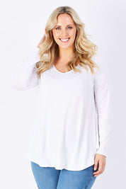 Model Jess wearing size 14 of the Long Sleeve Softly Swinging Bamboo Tee in colour White (White), from the front, cropped image