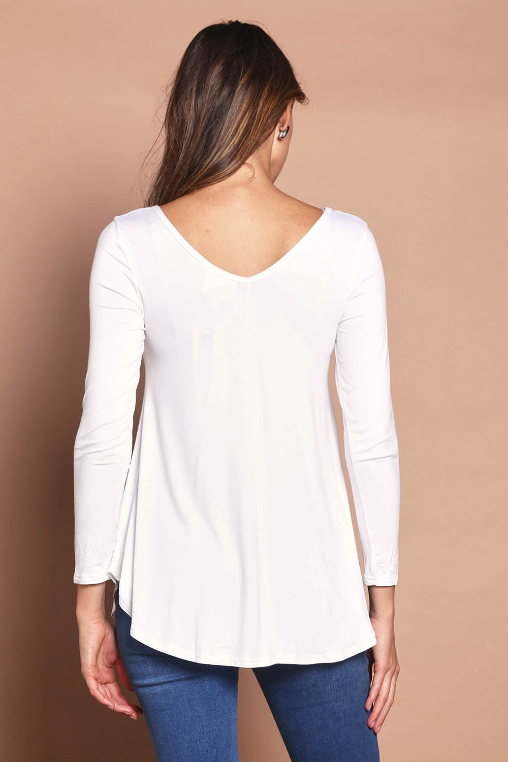 Model Madeline wearing size 10 of the Long Sleeve Softly Swinging Bamboo Tee in colour White (White), from the back