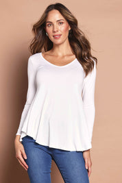 Model Madeline wearing size 10 of the Long Sleeve Softly Swinging Bamboo Tee in colour White (White), from the front, cropped image