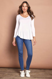 Model Madeline wearing size 10 of the Long Sleeve Softly Swinging Bamboo Tee in colour White (White), from the front, showing the whole outfit