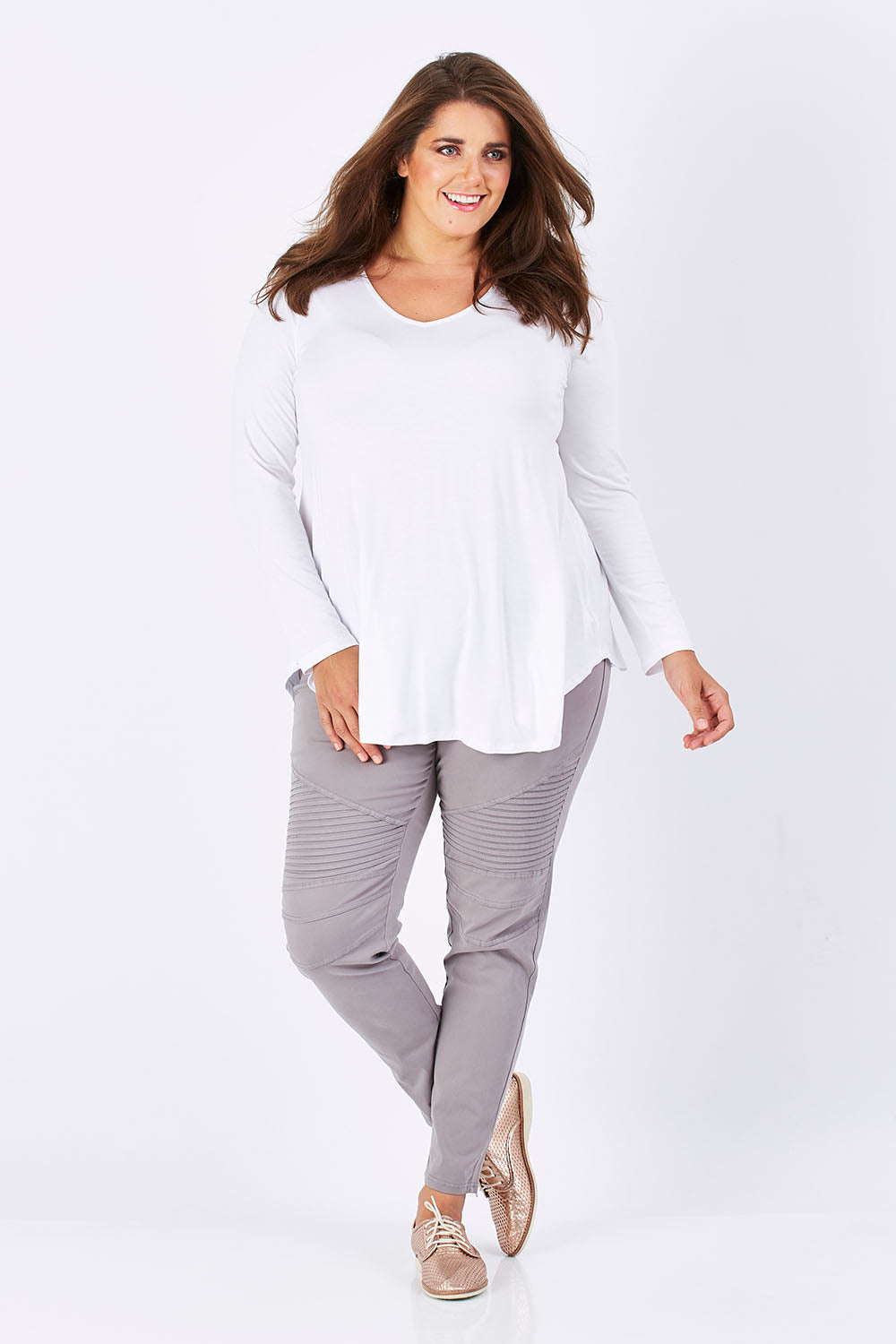 Model Mae wearing size 18 of the Long Sleeve Softly Swinging Bamboo Tee in colour White (White), from the front, showing the whole outfit