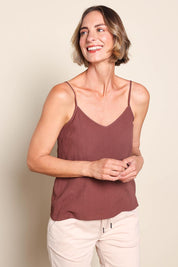 Model Riinar wearing size 10 of the Runaway Top – Chocolate in colour Chocolate, in a cropped view
