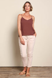 Model Riinar wearing size 10 of the Runaway Top – Chocolate in colour Chocolate, from the front