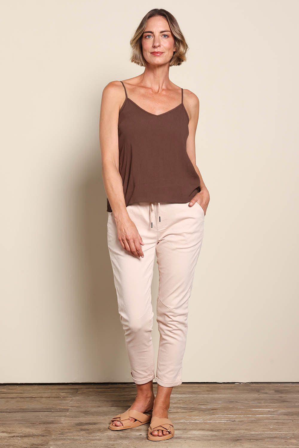 Model Riinar wearing size 10 of the Runaway Top – Chocolate in colour Chocolate, from the front