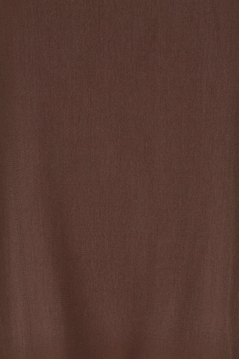 Product shot of the Runaway Top – Chocolate in colour Chocolate, showing detail