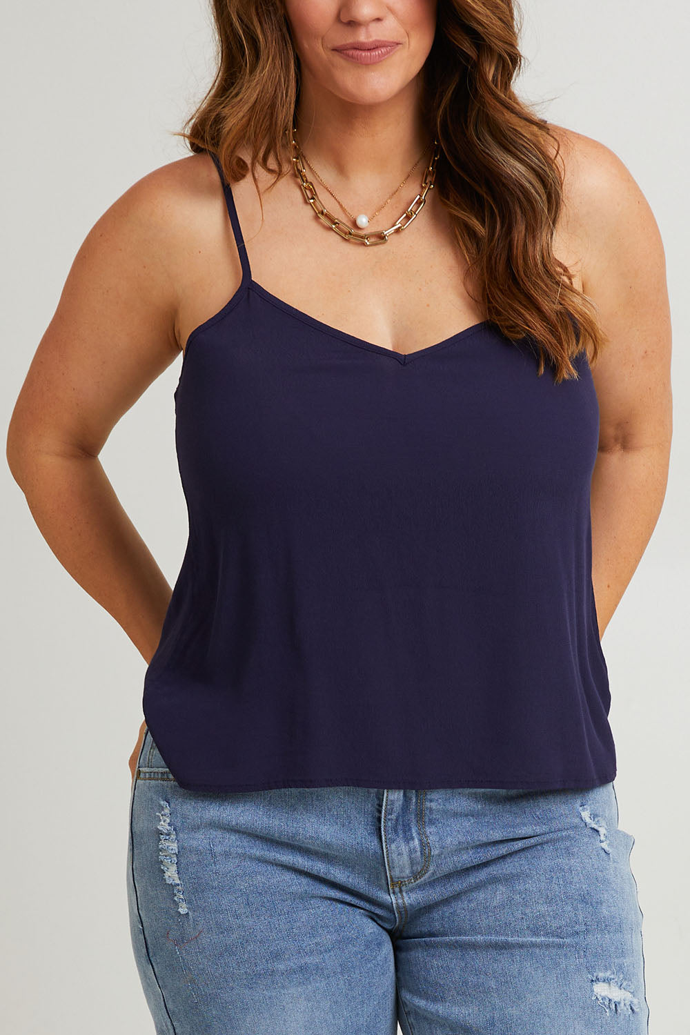 Model Laura wearing size 14 of the Runaway Top in colour Darknavy (Blue), from the front, cropped image