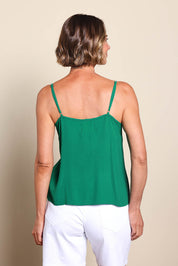 Model Riinar wearing size 10 of the Runaway Top – Emerald in colour Emerald, from the back