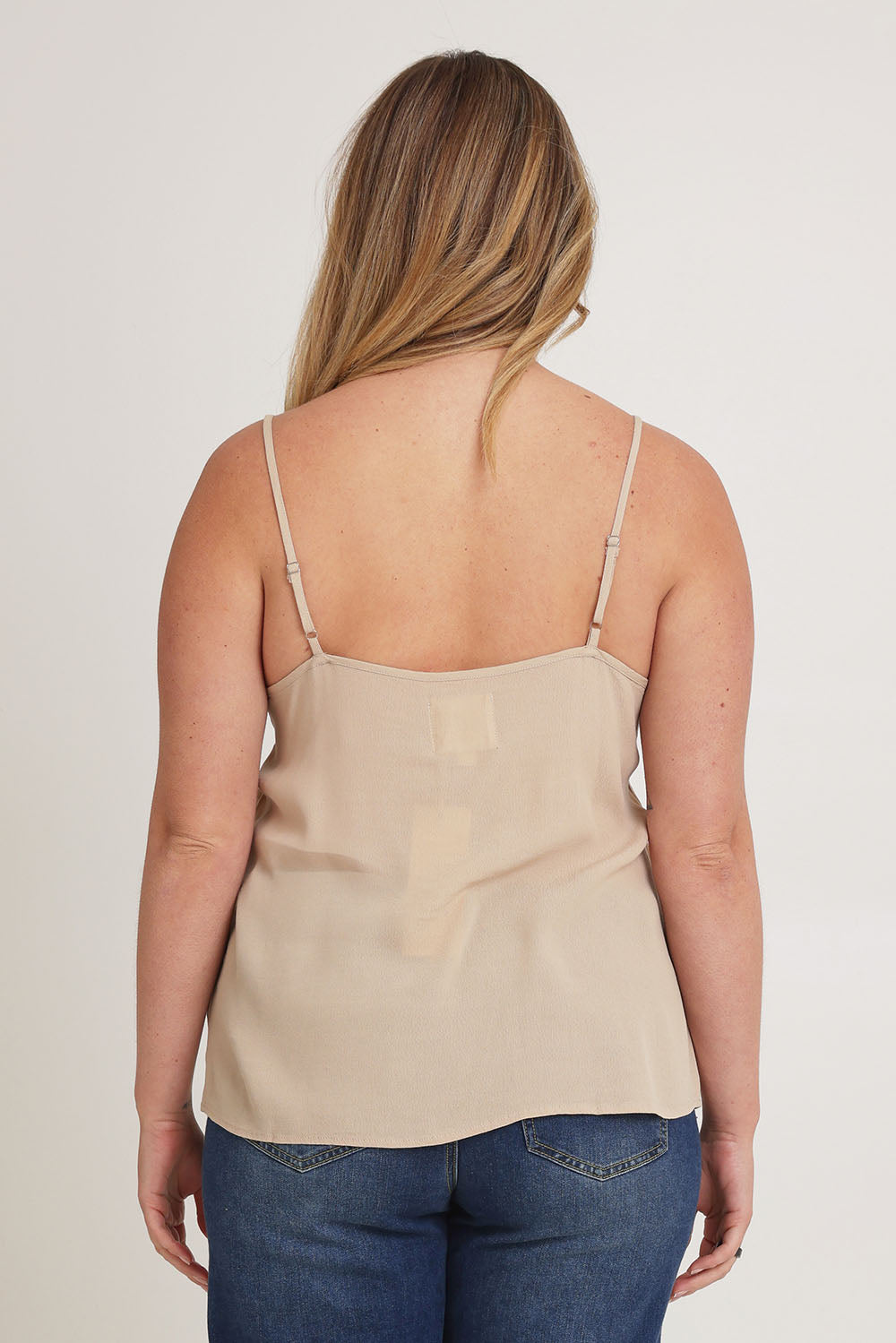 Model Chanel wearing size 16 of the Runaway Top in colour Latte, from the back