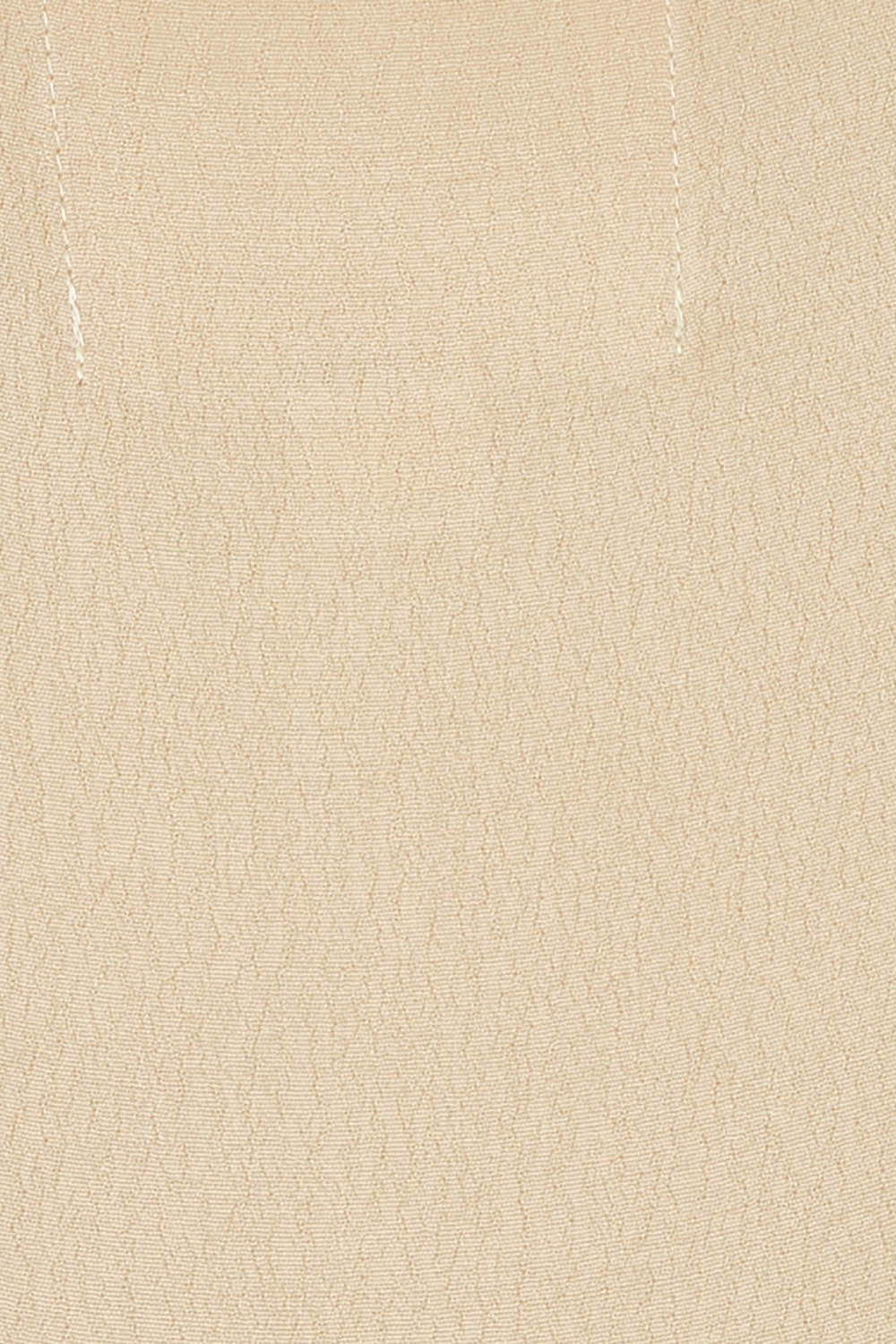 Product shot of the Runaway Top in colour Latte, detail