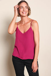 Model Riinar wearing size 10 of the Runaway Top – Plum in colour Plum, from an angle