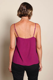 Model Riinar wearing size 10 of the Runaway Top – Plum in colour Plum, from the back